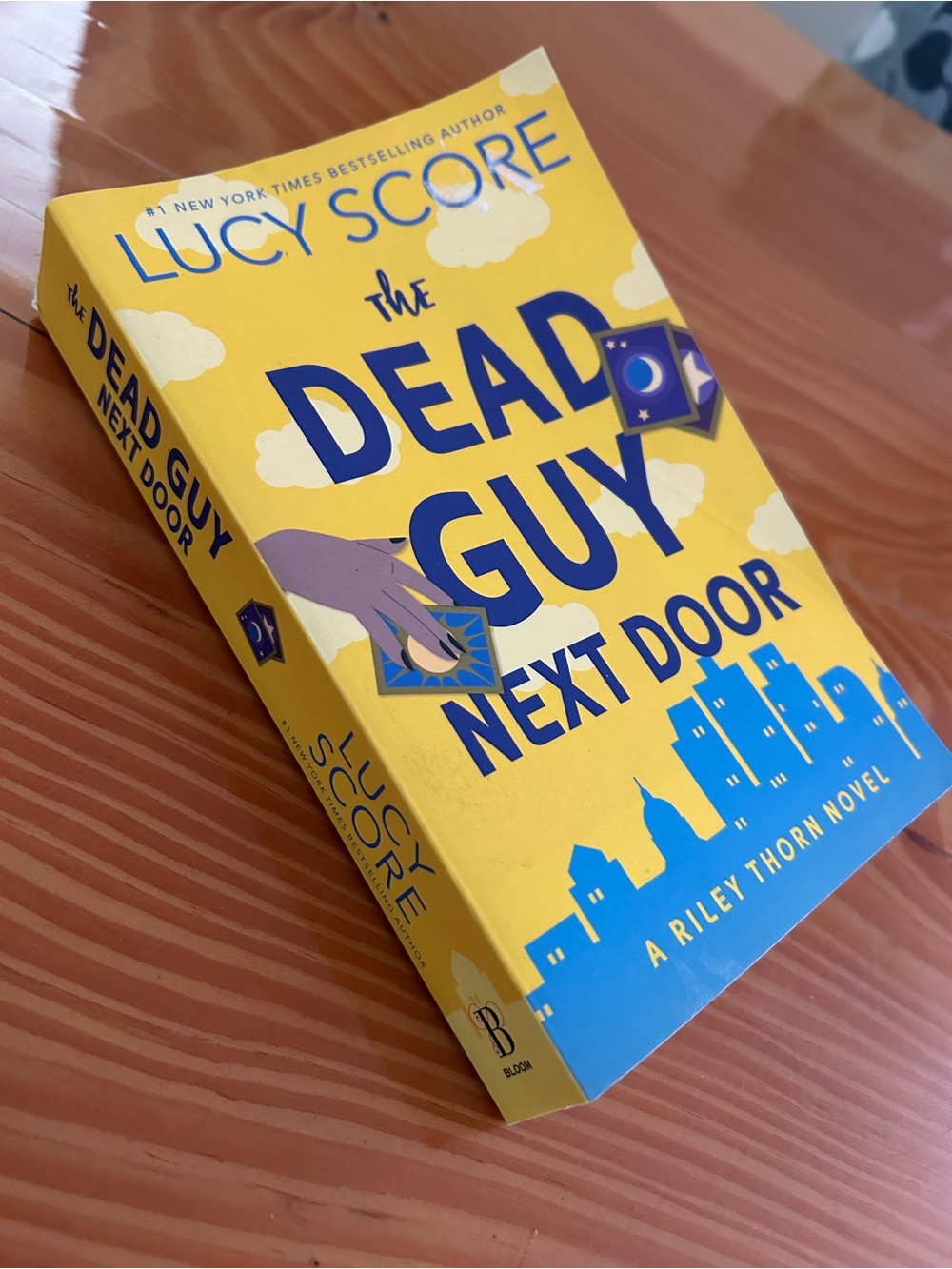 The Dead Guy Next Door — Lucy Score Paperback Book